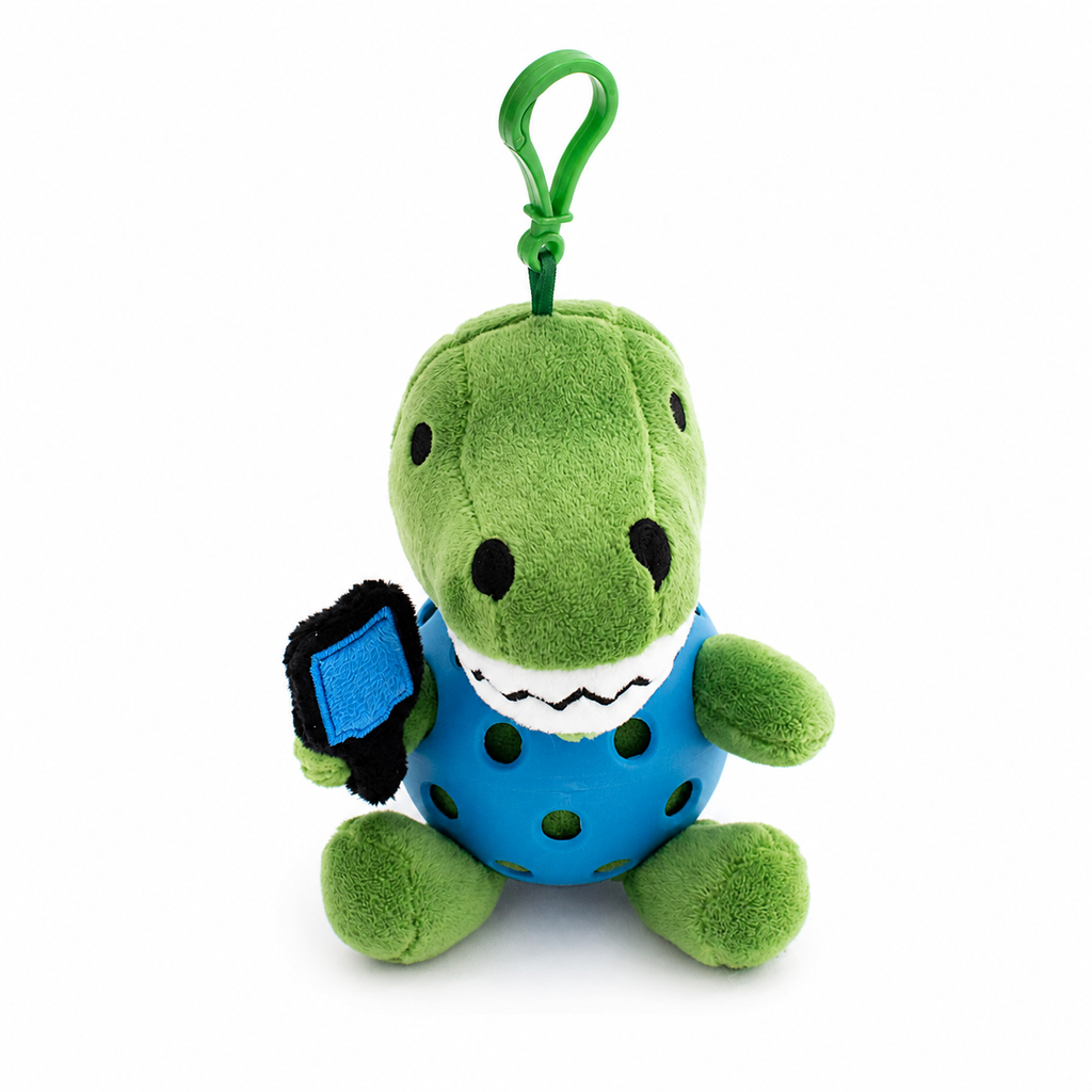 A plush T-rex toy inside a blue pickleball, attached to a green key ring, photographed on a clean white background.