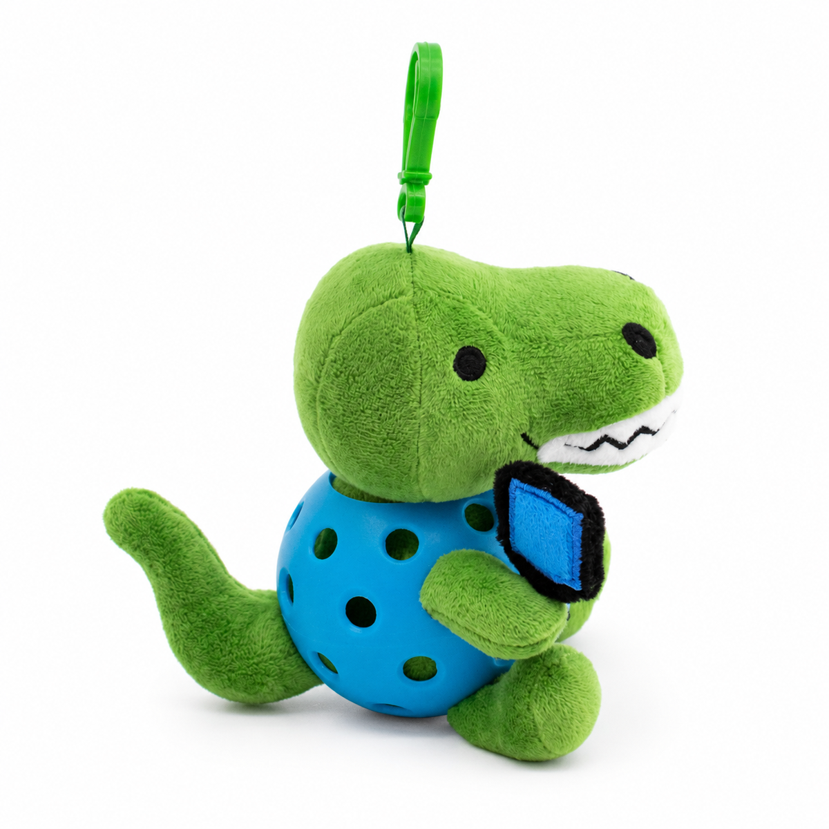 A plush T-rex toy inside a blue pickleball, attached to a green key ring, photographed on a clean white background.
