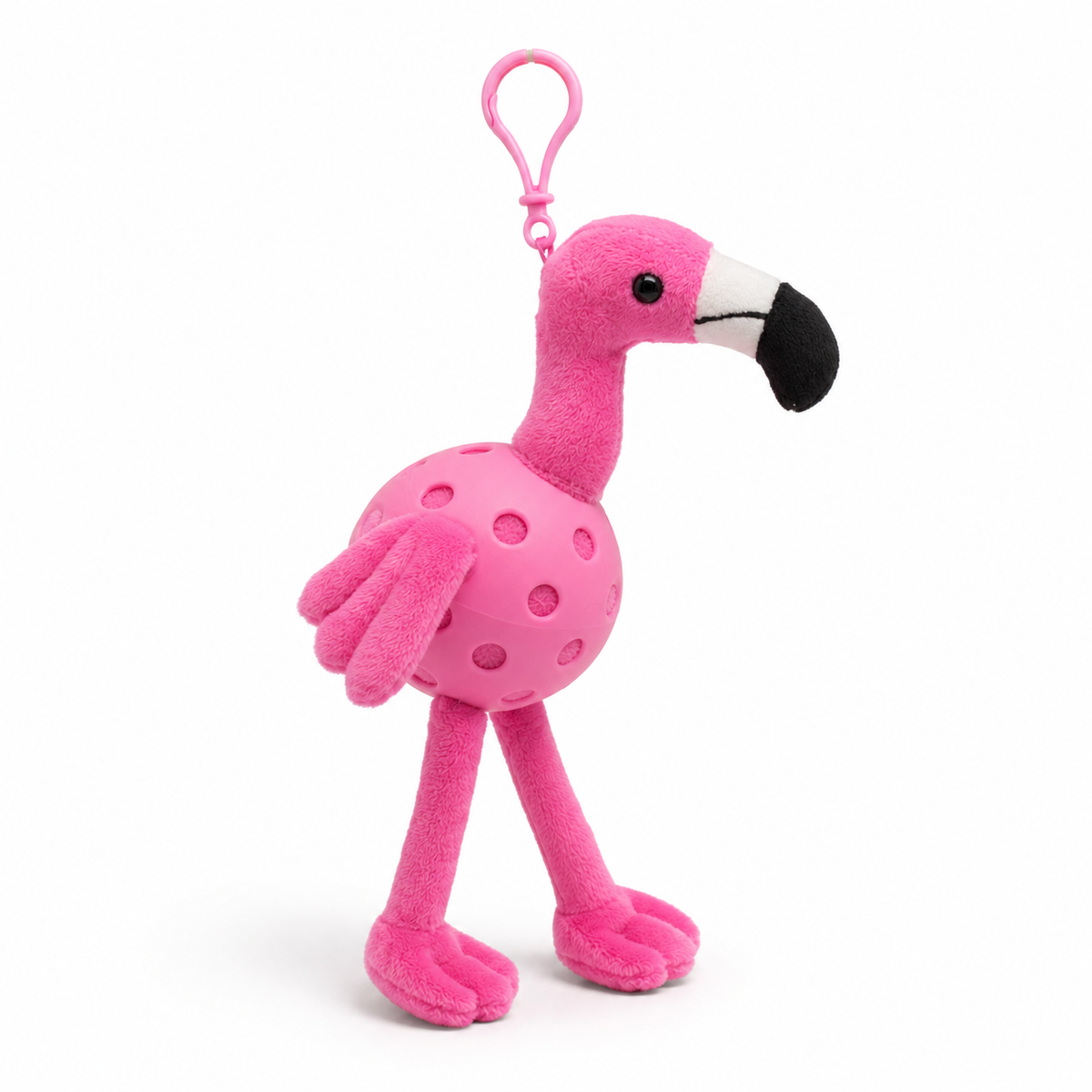 A plush flamingo toy inside a pink pickleball, attached to a pink key ring, photographed on a clean white background.