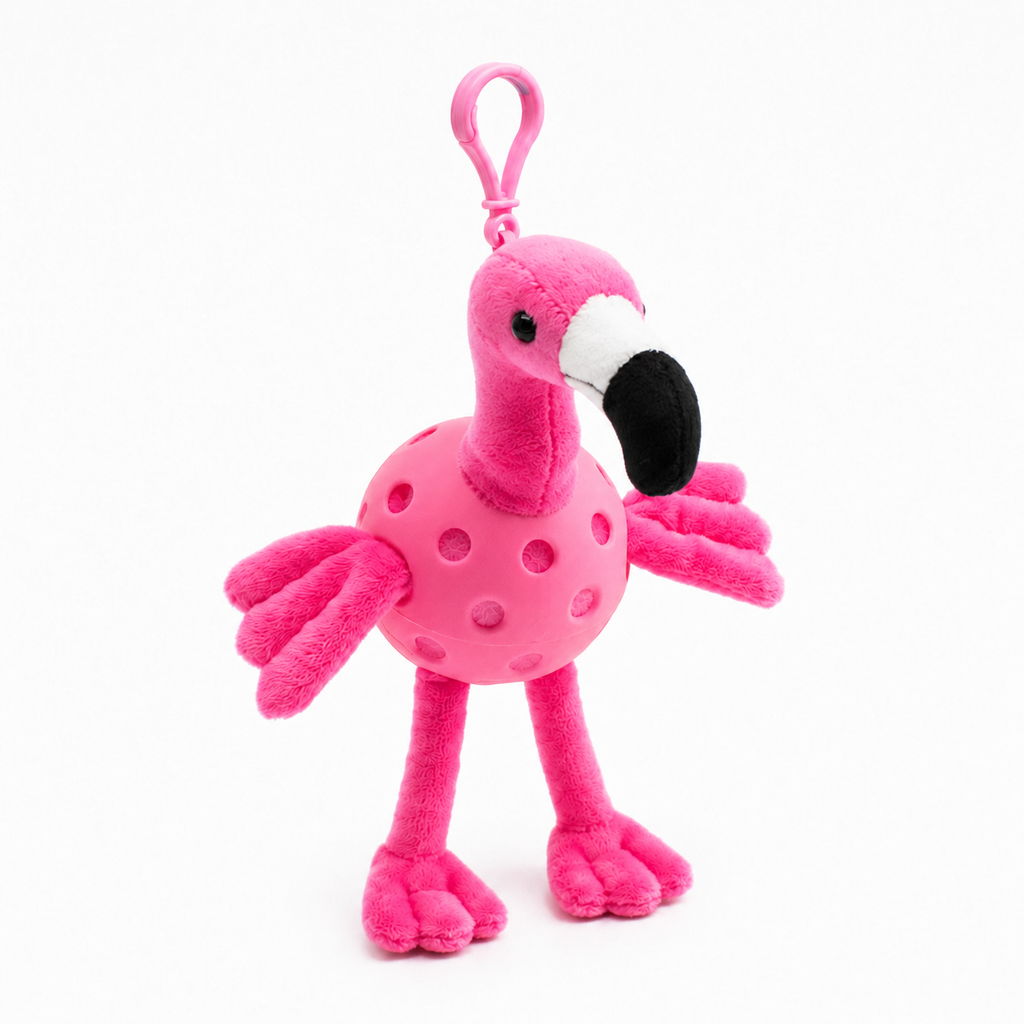 A plush flamingo toy inside a pink pickleball, attached to a pink key ring, photographed on a clean white background.