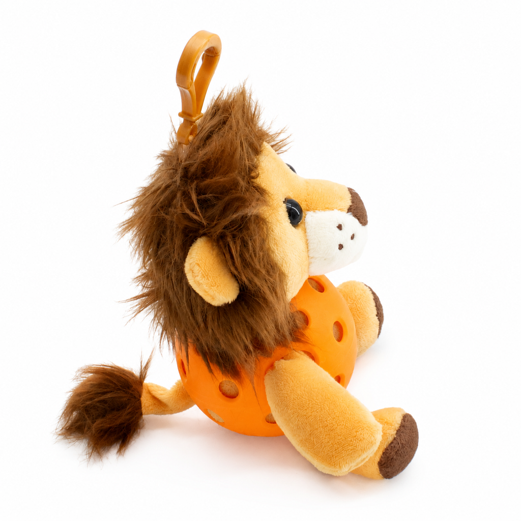 A plush lion toy inside an orange pickleball, attached to a orange key ring, photographed on a clean white background.