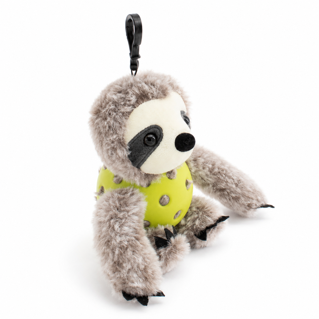 A plush sloth toy inside an green pickleball, attached to a black key ring, photographed on a clean white background.