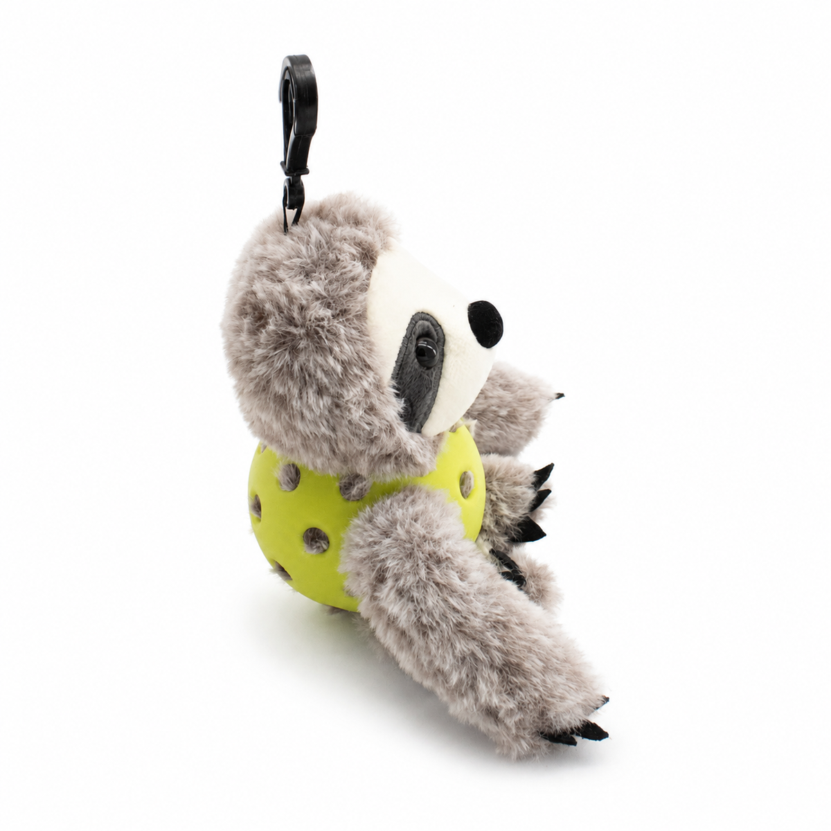 A plush sloth toy inside an green pickleball, attached to a black key ring, photographed on a clean white background.