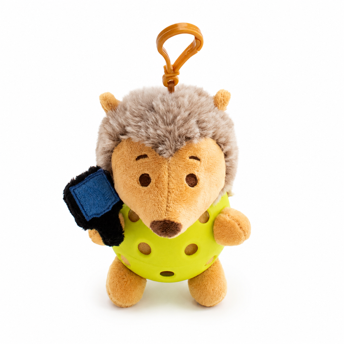 A plush hedgehog toy inside a yellow pickleball, attached to a yellow key ring, photographed on a clean white background.