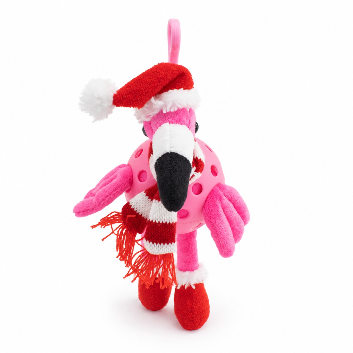 A pink plush flamingo toy with a Santa hat, red and white striped scarf, and red boot covers, photographed on a clean white background.