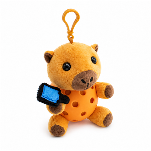 A plush capybara toy inside a orange pickleball, attached to a orange key ring, photographed on a clean white background.